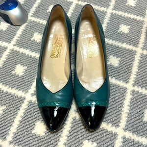 Emerald green kitten heels with greet snake skin and black patent across toe